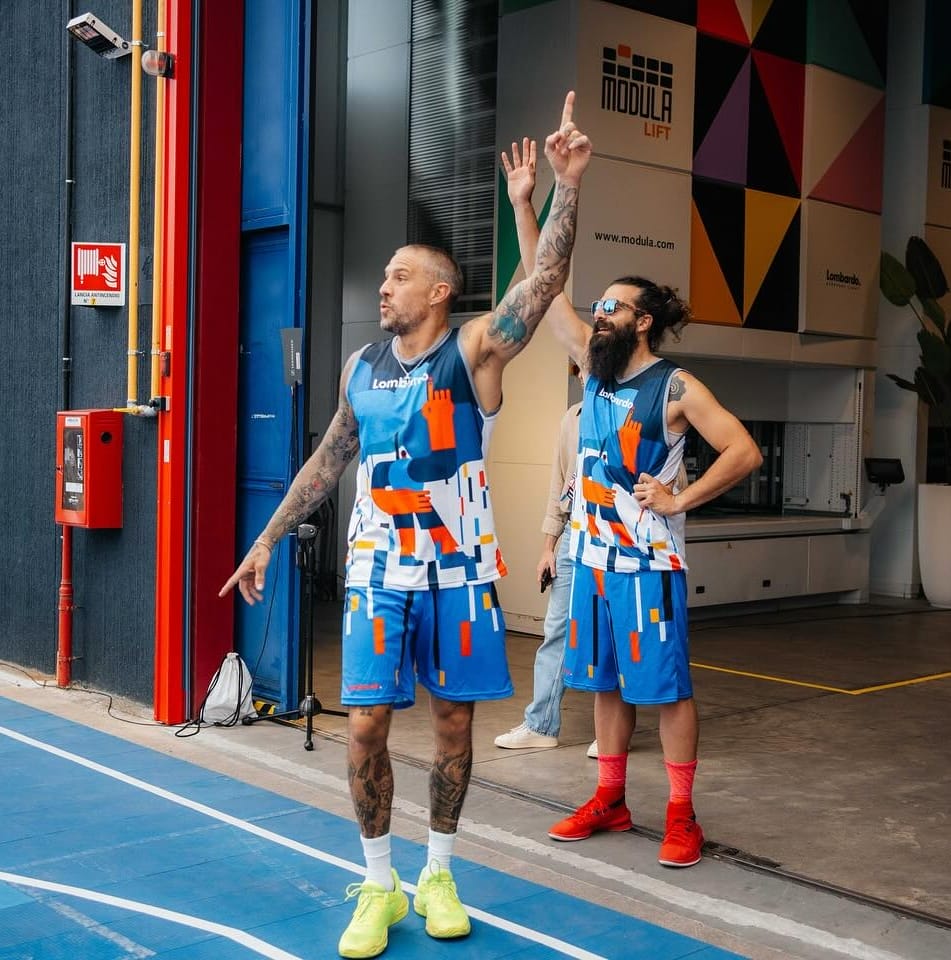 Employees playing basketball in the company court during an event
