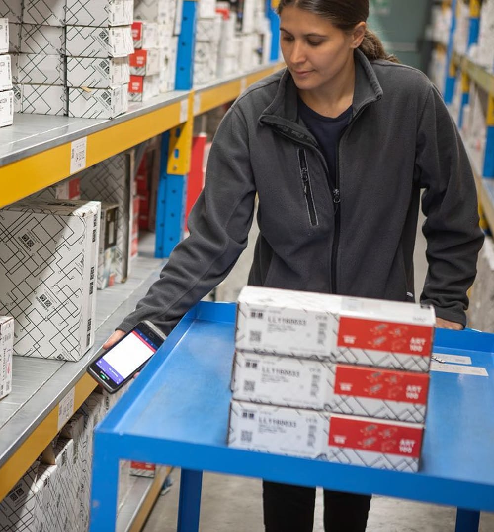 Warehouse employee scanning product barcodes